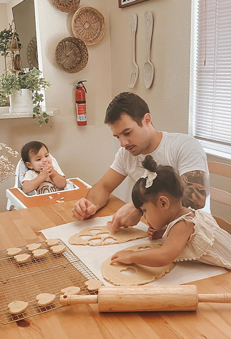Family in kitchen with Fire Extinguisher
